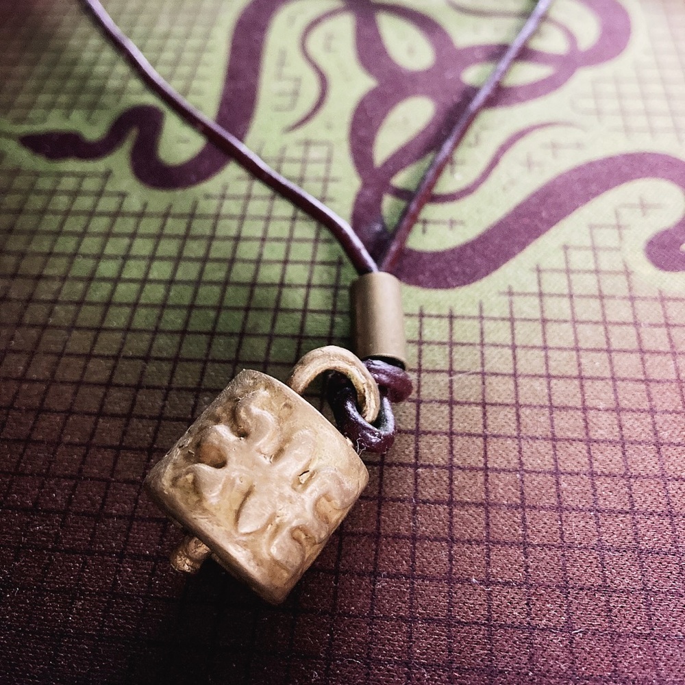 Cowbell necklace